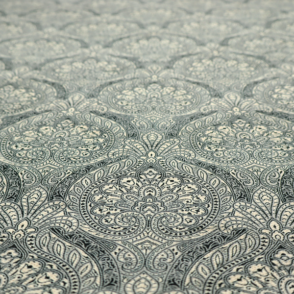 An intricate, repeating damask and paisley design.