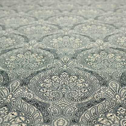 An intricate, repeating damask and paisley design.