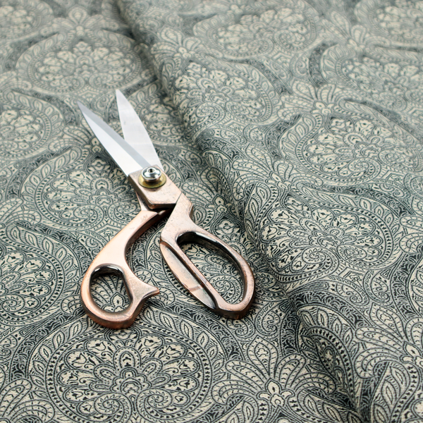 An intricate, repeating damask and paisley design.