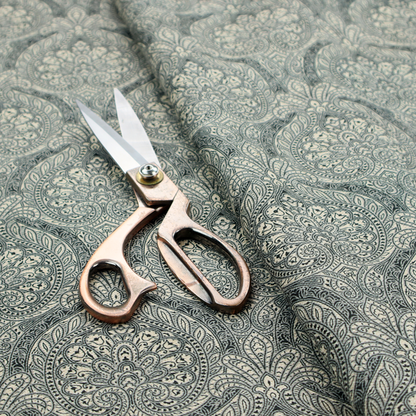 An intricate, repeating damask and paisley design.