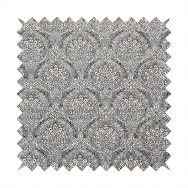 An intricate, repeating damask and paisley design on fabric, featuring elegant, symmetrical motifs.