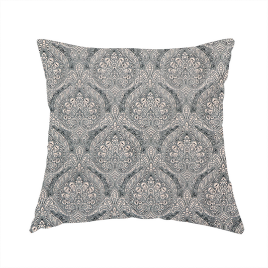 The fabric used to create these handmade cushions is a  intricate, repeating damask and paisley design on fabric, featuring elegant, symmetrical motifs.