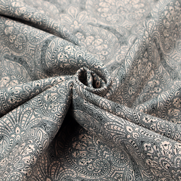 An intricate, repeating damask and paisley design on fabric, featuring elegant, symmetrical motifs.