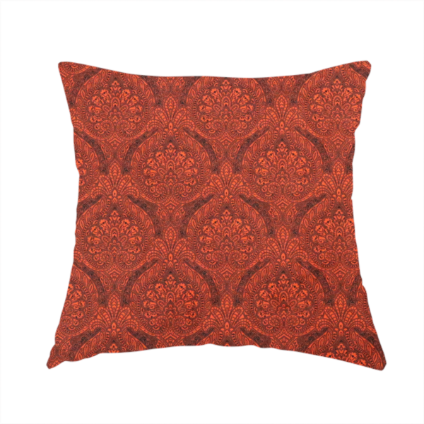 The fabric used to create this handmade cushion is a intricate, repeating damask and paisley design on fabric, featuring elegant, symmetrical motifs.