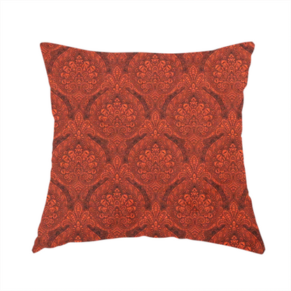 The fabric used to create this handmade cushion is a intricate, repeating damask and paisley design on fabric, featuring elegant, symmetrical motifs.