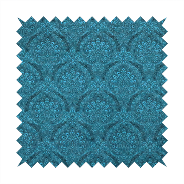 An intricate, repeating damask and paisley design on fabric, featuring elegant, symmetrical motifs.