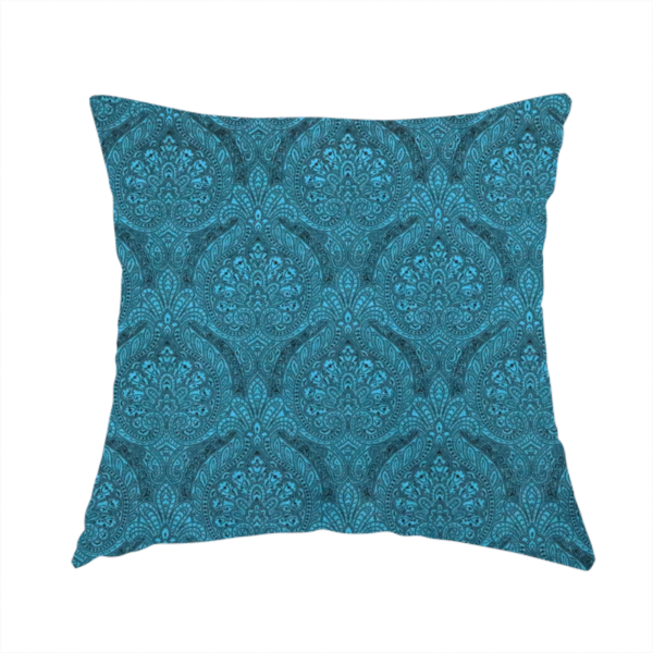 The fabric used to create this handmade cushion is a intricate, repeating damask and paisley design on fabric, featuring elegant, symmetrical motifs.