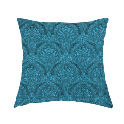 The fabric used to create this handmade cushion is a intricate, repeating damask and paisley design on fabric, featuring elegant, symmetrical motifs.