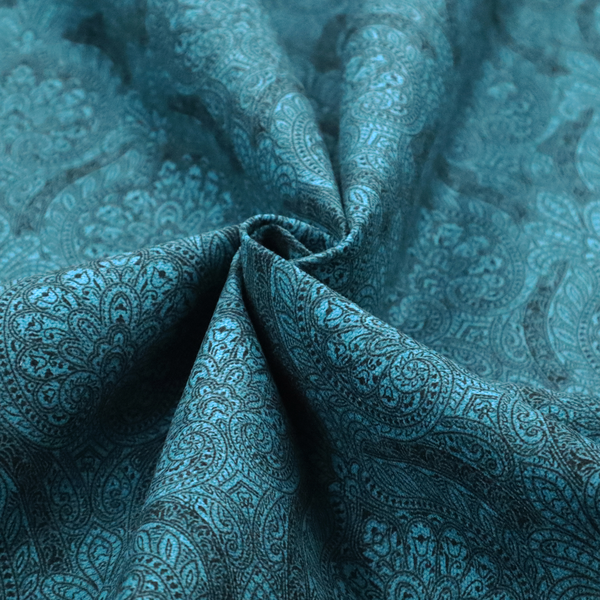 An intricate, repeating damask and paisley design on fabric, featuring elegant, symmetrical motifs.