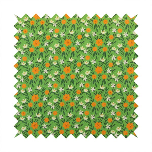A bright green fabric featuring a dense, repeating pattern of small orange flowers, delicate white blossoms, and dark green leaves.