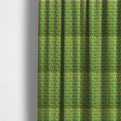 The fabric used to create these made-to-measure curtains is a bright green fabric featuring a dense, repeating pattern of small orange flowers, delicate white blossoms, and dark green leaves.