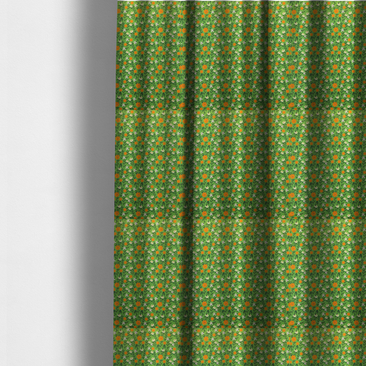 The fabric used to create these made-to-measure curtains is a bright green fabric featuring a dense, repeating pattern of small orange flowers, delicate white blossoms, and dark green leaves.