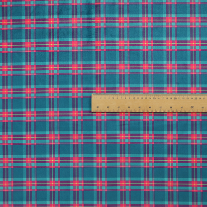 Vibrant teal and pink tartan plaid fabric featuring a classic checked pattern with intersecting lines in rich turquoise, bright magenta, and subtle yellow highlights.