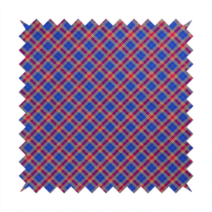 Vibrant blue and red diamond plaid fabric featuring an intricate diagonal checked pattern with intersecting lines in rich royal blue, bright red, and yellow highlights.