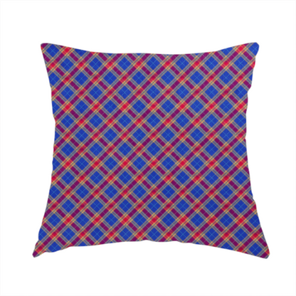 The fabric used to create this handmade cushion is a vibrant blue and red diamond plaid fabric featuring an intricate diagonal checked pattern with intersecting lines in rich royal blue, bright red, and yellow highlights.