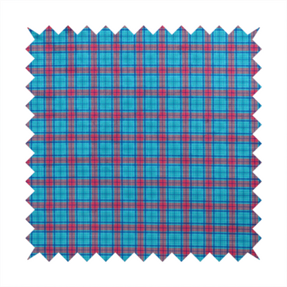 Bright turquoise and red plaid fabric featuring a classic checked pattern with intersecting lines in rich turquoise, vibrant red, and dark blue accents.
