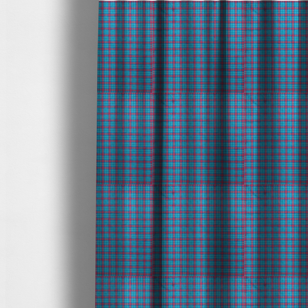 The fabric used to create these made-to-measure curtains is a bright turquoise and red plaid fabric featuring a classic checked pattern with intersecting lines in rich turquoise, vibrant red, and dark blue accents.