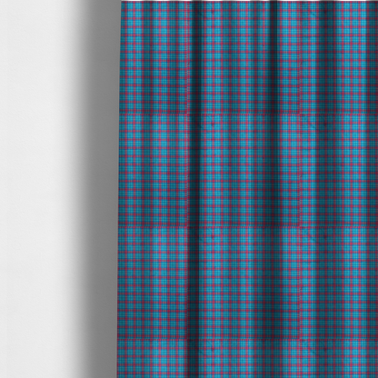 The fabric used to create these made-to-measure curtains is a bright turquoise and red plaid fabric featuring a classic checked pattern with intersecting lines in rich turquoise, vibrant red, and dark blue accents.