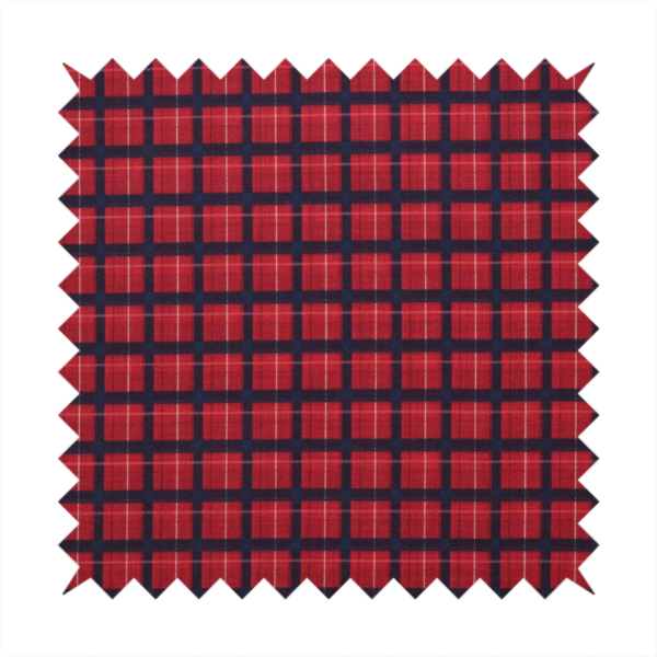 Bold red and navy plaid fabric featuring a structured checked pattern with prominent dark navy grids, vibrant red blocks, and subtle white pin lines.