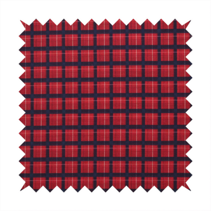 Bold red and navy plaid fabric featuring a structured checked pattern with prominent dark navy grids, vibrant red blocks, and subtle white pin lines.