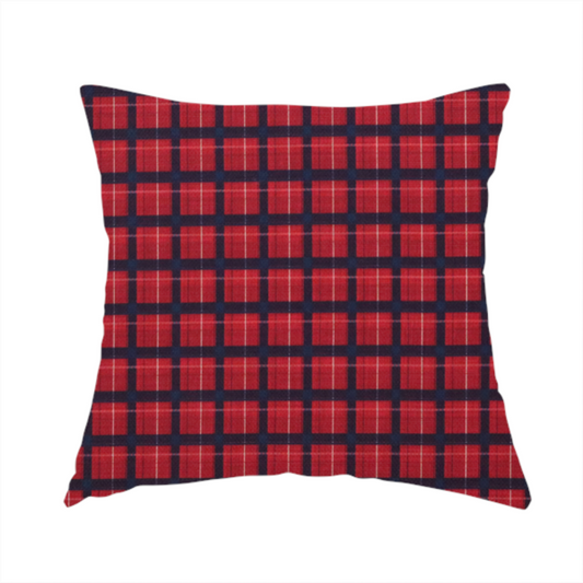 The fabric used to create this handmade cushion is a bold red and navy plaid fabric featuring a structured checked pattern with prominent dark navy grids, vibrant red blocks, and subtle white pin lines.
