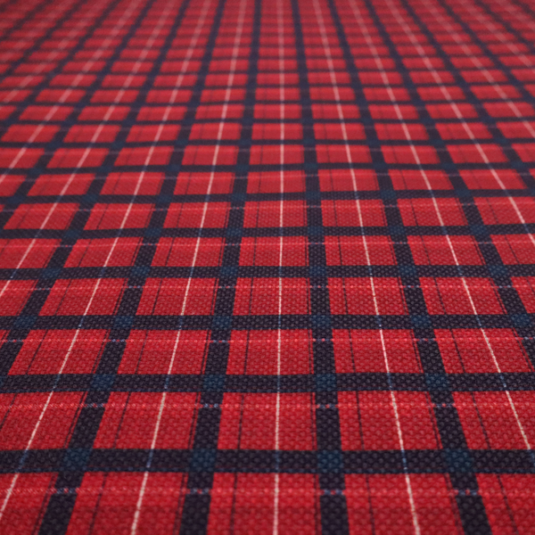 Bold red and navy plaid fabric featuring a structured checked pattern with prominent dark navy grids, vibrant red blocks, and subtle white pin lines.