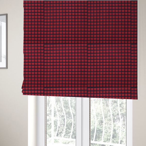 The fabric used to create these Roman blinds is a bold red and navy plaid fabric featuring a structured checked pattern with prominent dark navy grids, vibrant red blocks, and subtle white pin lines.