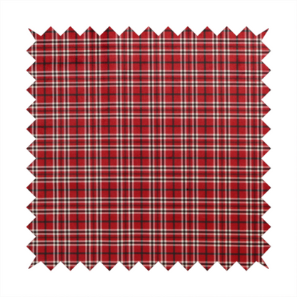 Classic red and black tartan plaid fabric featuring a traditional checked pattern with intersecting lines in rich red, dark black, and subtle white highlights.