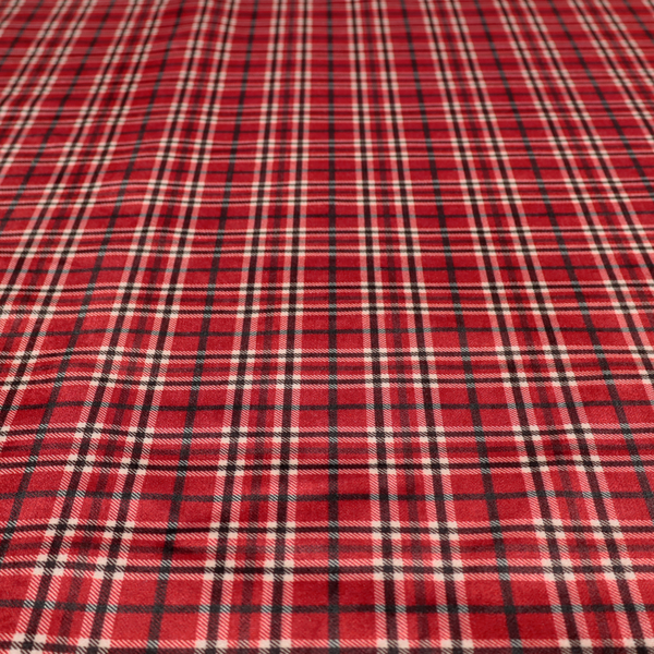 Classic red and black tartan plaid fabric featuring a traditional checked pattern with intersecting lines in rich red, dark black, and subtle white highlights.