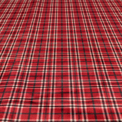 Classic red and black tartan plaid fabric featuring a traditional checked pattern with intersecting lines in rich red, dark black, and subtle white highlights.