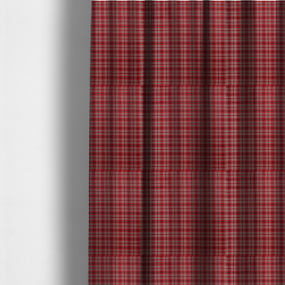 The fabric used to create these made-to-measure curtains is a classic red and black tartan plaid fabric featuring a traditional checked pattern with intersecting lines in rich red, dark black, and subtle white highlights.