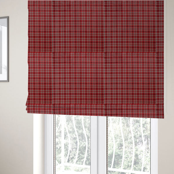 The fabric used to create these Roman blinds is a classic red and black tartan plaid fabric featuring a traditional checked pattern with intersecting lines in rich red, dark black, and subtle white highlights.