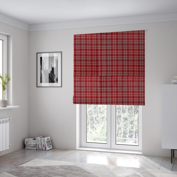 The fabric used to create these Roman blinds is a classic red and black tartan plaid fabric featuring a traditional checked pattern with intersecting lines in rich red, dark black, and subtle white highlights.