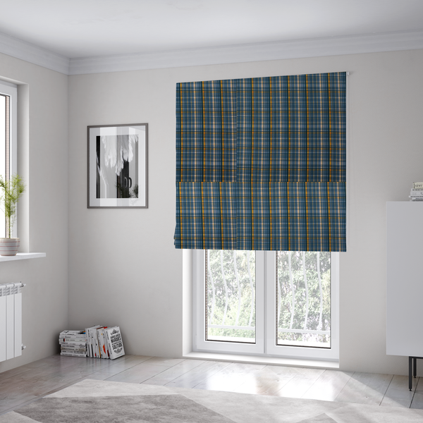 The fabric used to create these Roman blinds is a blue and gold plaid fabric featuring a structured checked pattern with intersecting lines in muted slate blue, deep navy, vibrant gold, and crisp white pin lines.