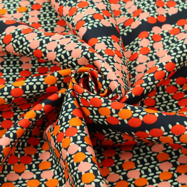 Horizontal bands of intricate geometric designs composed of small dots or bead-like shapes forming repeating lattice and chevron motifs.
