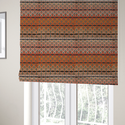The fabric used to create these Roman blinds is a horizontal bands of intricate geometric designs composed of small dots or bead-like shapes forming repeating lattice and chevron motifs.