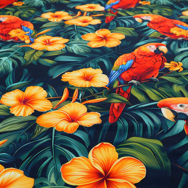 A tropical jungle print featuring vibrant red and yellow macaws perched amidst large green monstera leaves and bright yellow hibiscus flowers.