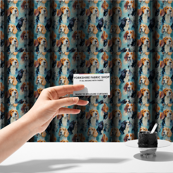 The fabric used to create these made-to-measure curtains is a repeating illustrated pattern featuring portraits of beagle dogs in various poses and colour variations against a soft blue background.