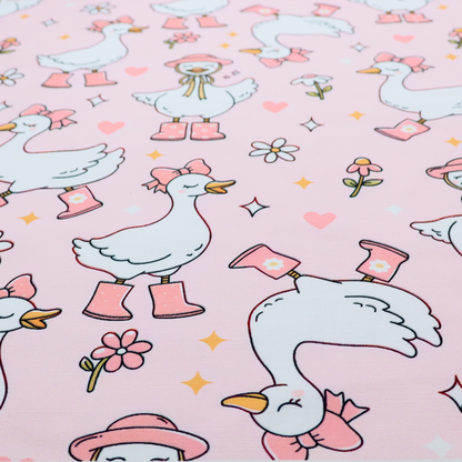 A cute, whimsical cartoon print featuring white geese wearing pink rain boots and matching pink hats or bows, interspersed with small flowers, hearts, and sparkles.