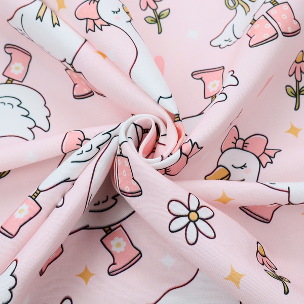 A cute, whimsical cartoon print featuring white geese wearing pink rain boots and matching pink hats or bows, interspersed with small flowers, hearts, and sparkles.