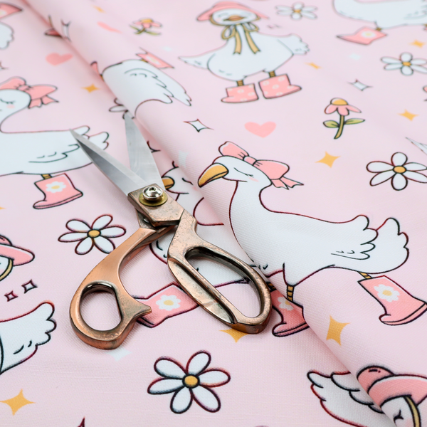 A cute, whimsical cartoon print featuring white geese wearing pink rain boots and matching pink hats or bows, interspersed with small flowers, hearts, and sparkles.