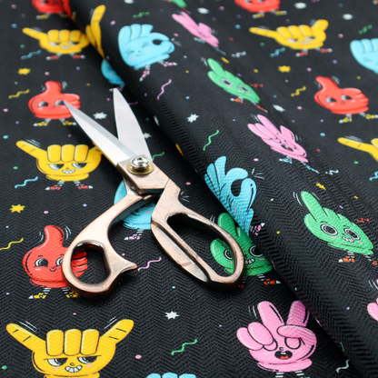 A quirky, fun cartoon print featuring anthropomorphic hands with cute faces making various gestures (like thumbs up, peace signs, and rock hand signs), scattered among tiny stars and squiggly lines.
