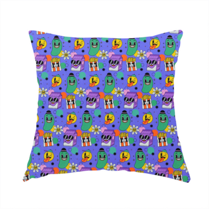 The fabric used to create this handmade cushion is a vibrant, retro-cartoon all-over print featuring quirky, smiling food and character motifs against a blue-purple background.