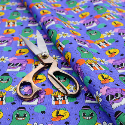 A vibrant, retro-cartoon all-over print featuring quirky, smiling food and character motifs against a blue-purple background.