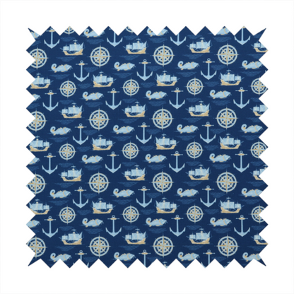 A nautical-themed fabric pattern featuring alternating rows of light blue and gold sailing ships, compass roses, anchors, and fish against a dark blue background.