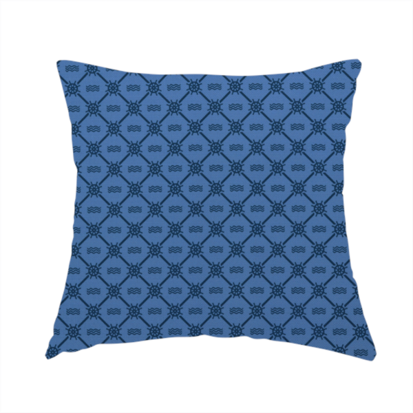 The fabric used to create this handmade cushion is a nautical-themed fabric pattern featuring a repeating navy blue geometric grid of ship's wheels and small wavy lines against a medium blue background.