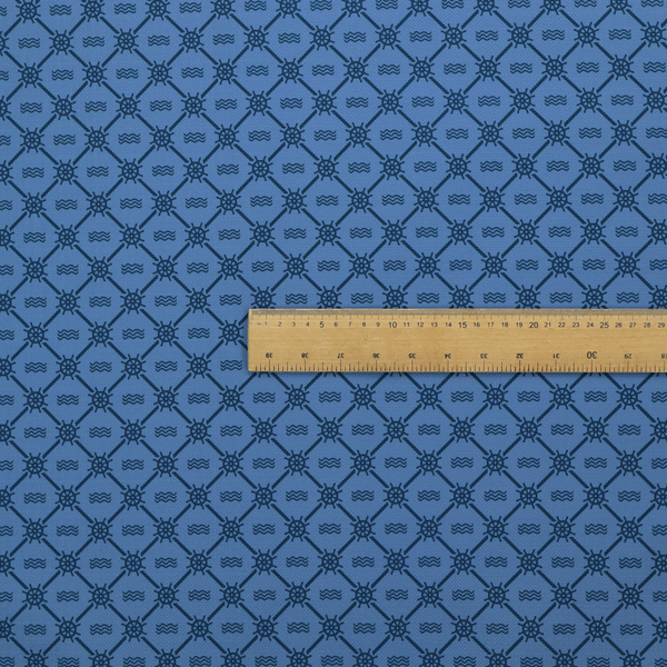 A nautical-themed fabric pattern featuring a repeating navy blue geometric grid of ship's wheels and small wavy lines against a medium blue background.