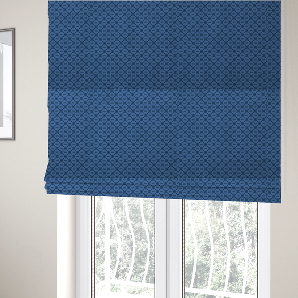 The fabric used to create these Roman blinds is a nautical-themed fabric pattern featuring a repeating navy blue geometric grid of ship's wheels and small wavy lines against a medium blue background.