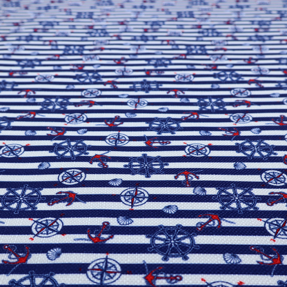 A nautical-themed fabric pattern featuring alternating horizontal stripes of navy blue and light blue, scattered with small dark blue ship's wheels, red anchors, and compass roses.