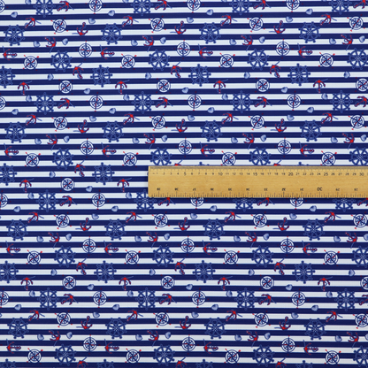 A nautical-themed fabric pattern featuring alternating horizontal stripes of navy blue and light blue, scattered with small dark blue ship's wheels, red anchors, and compass roses.